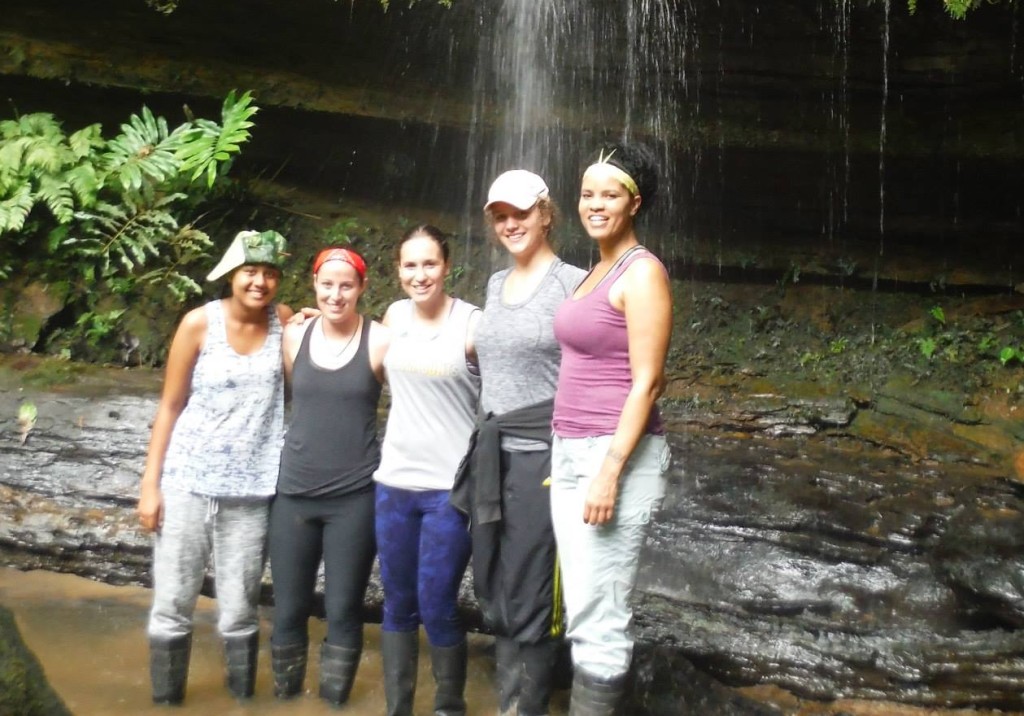 A group of five stand in a canyon in the Amazon jungle.